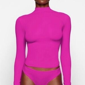 SKIMS Fits Everybody Long Sleeve Mock Neck T-Shirt in Fuchsia